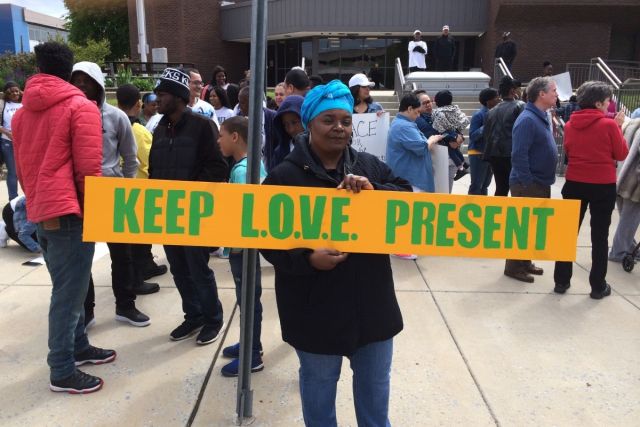 Promoting keep love present at a community rally.
